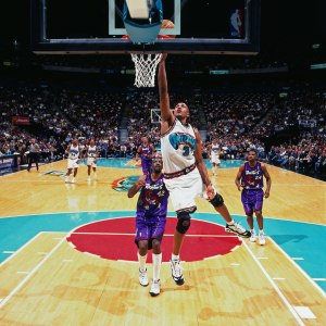 ex- Naismith Cup game in action, shows Shareef Abudr Rahim going for a one-handed slam against the Raptors in 1997.